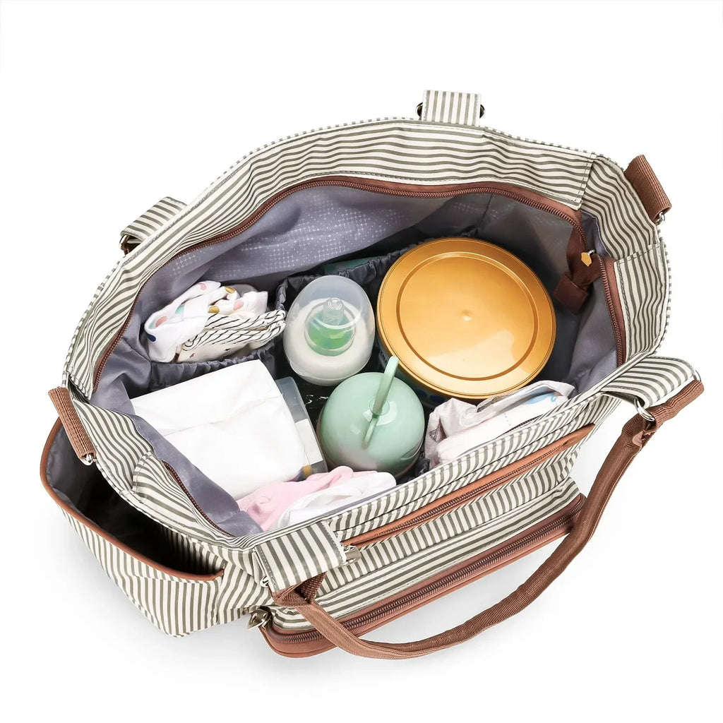 Beige striped diaper bag opened showing bottles, wipes, and accessories inside