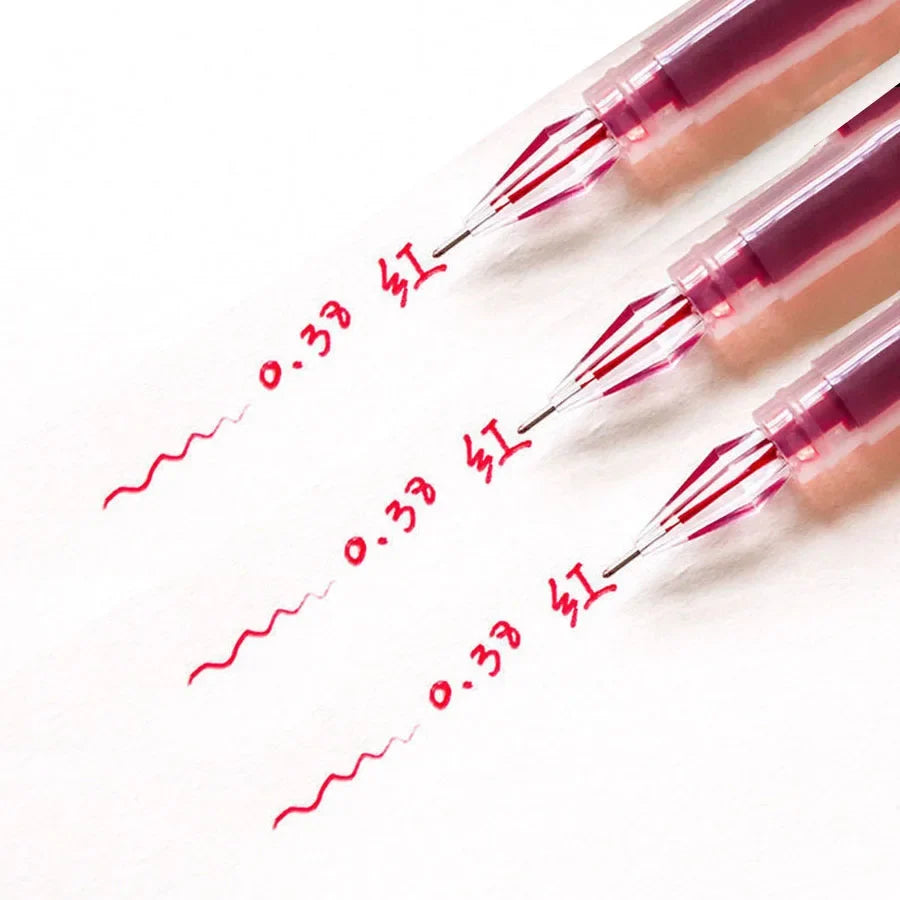 Diamond tip gel pens with red fine 0.38mm ink lines on white paper