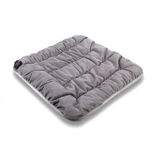 Gray adjustable heated pet cushion with quilted channels and controller at the corner.