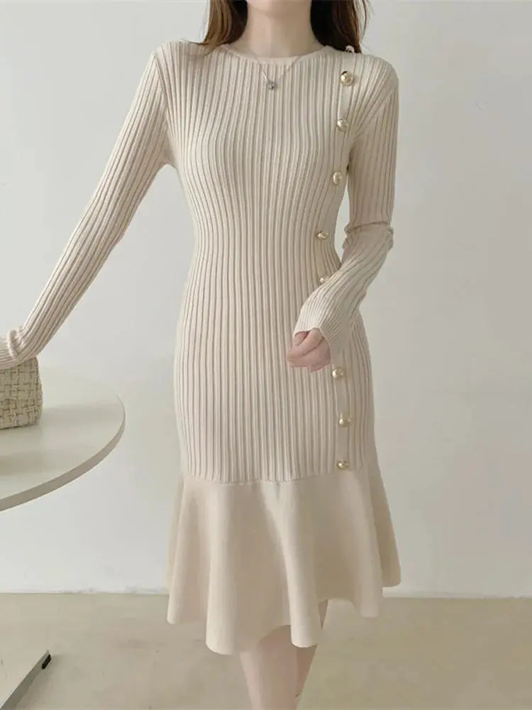 Apricot ribbed knit sweater dress with long sleeves, gold buttons, and skirt flounce.