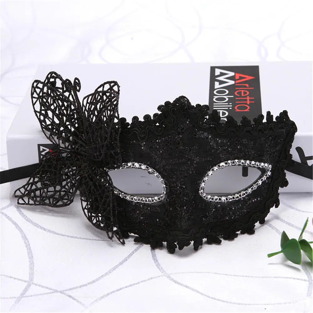 Black lace cat masquerade mask with rhinestone accents and decorative fringe