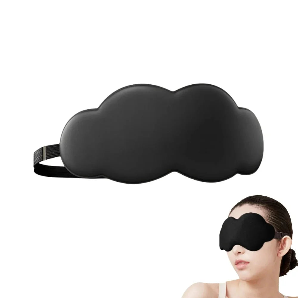 Black contoured sleep eye mask with nose cutout; person wearing the mask