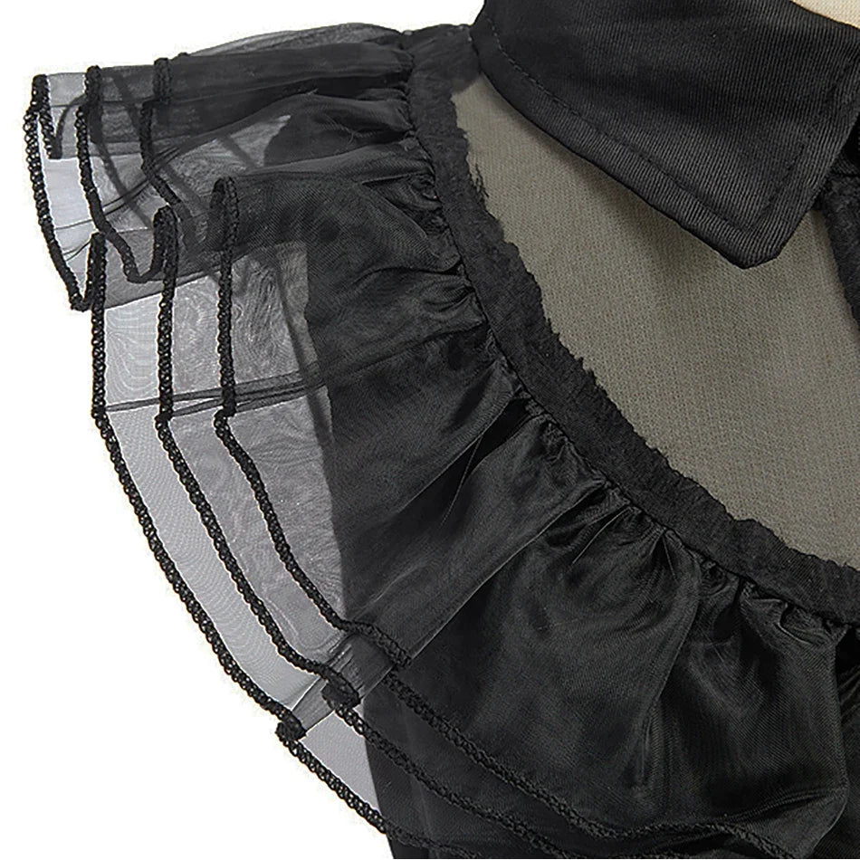 Black layered tulle skirt with ruffled trim and attached shoulder tulle detail