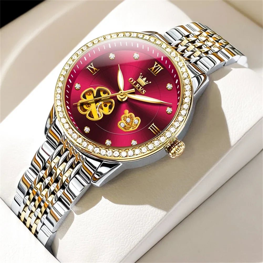 Two-tone automatic bracelet watch with red floral dial, gold hands, jeweled bezel