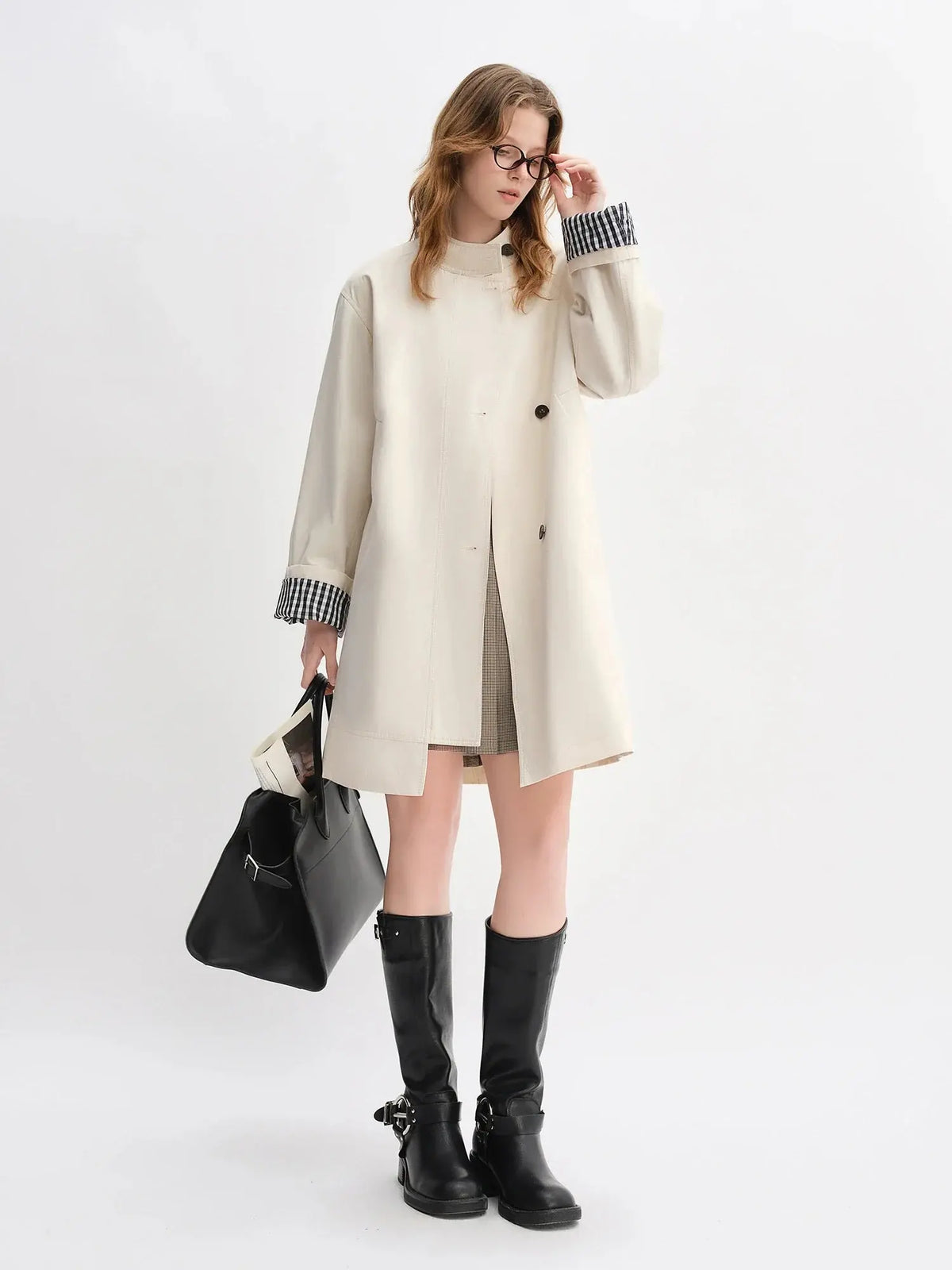 Beige stand-collar windbreaker with plaid cuffs, snap-button front, knee-length hem