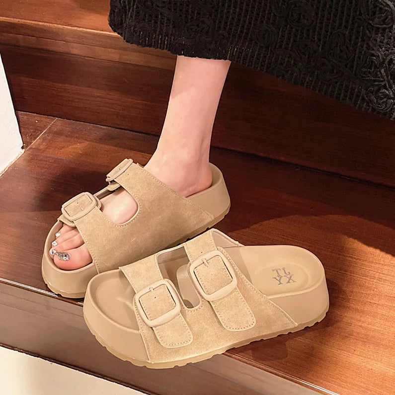 Beige suede slip-on platform slides with two adjustable buckle straps
