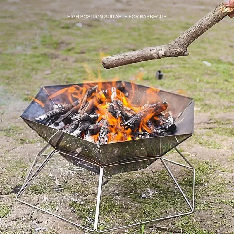 Outdoor brazier grill with active flames, stacked logs, and metal stand