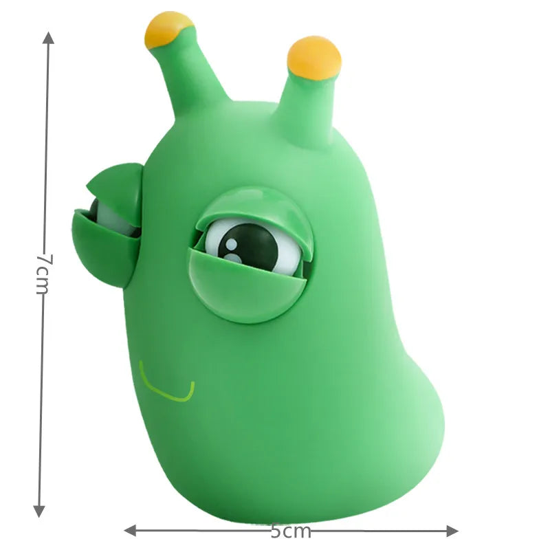Green worm squeeze fidget toy with pop-out eyes, side view size