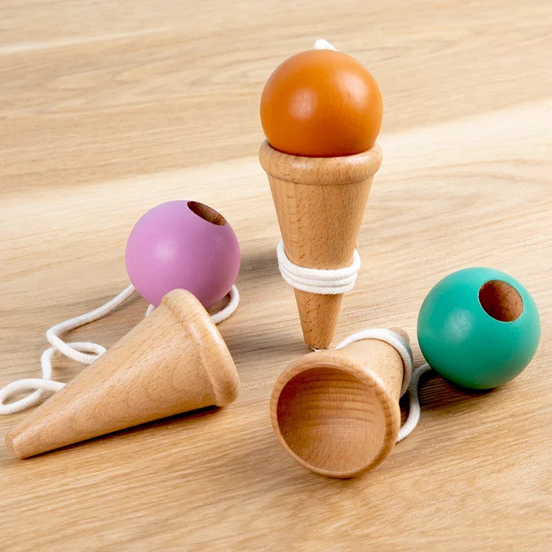 Wooden cup-and-ball toy with multicolor balls and small wooden catch cups