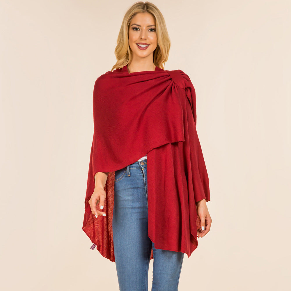Burgundy solid drape wrap poncho with shoulder knot, flowing layered sides over jeans