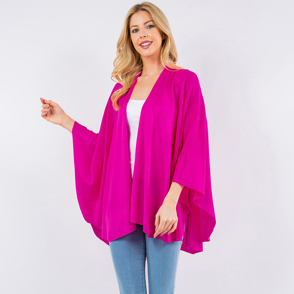Fuchsia pink drape wrap poncho with cowl neckline and oversized flowing sleeves