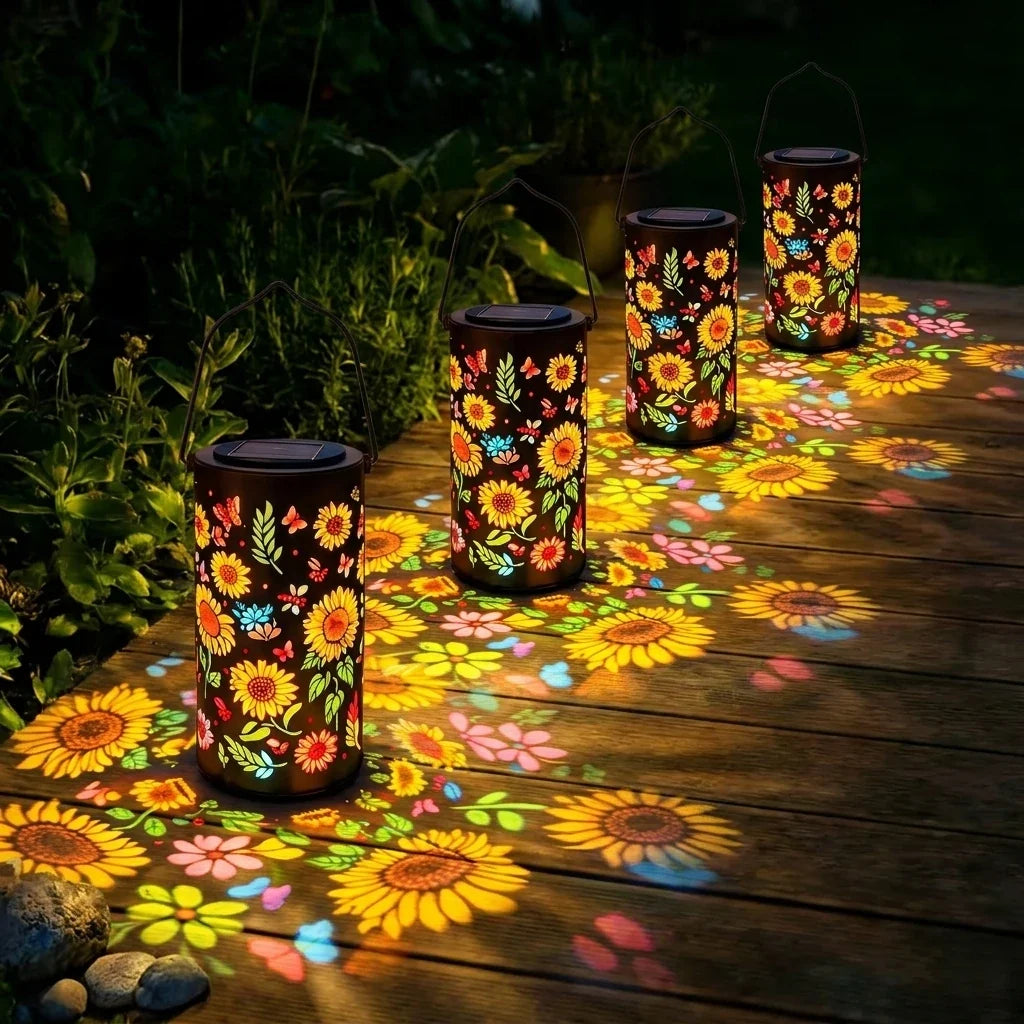 Colorful sunflower solar lantern with black top and cylindrical metal body, outdoor glow