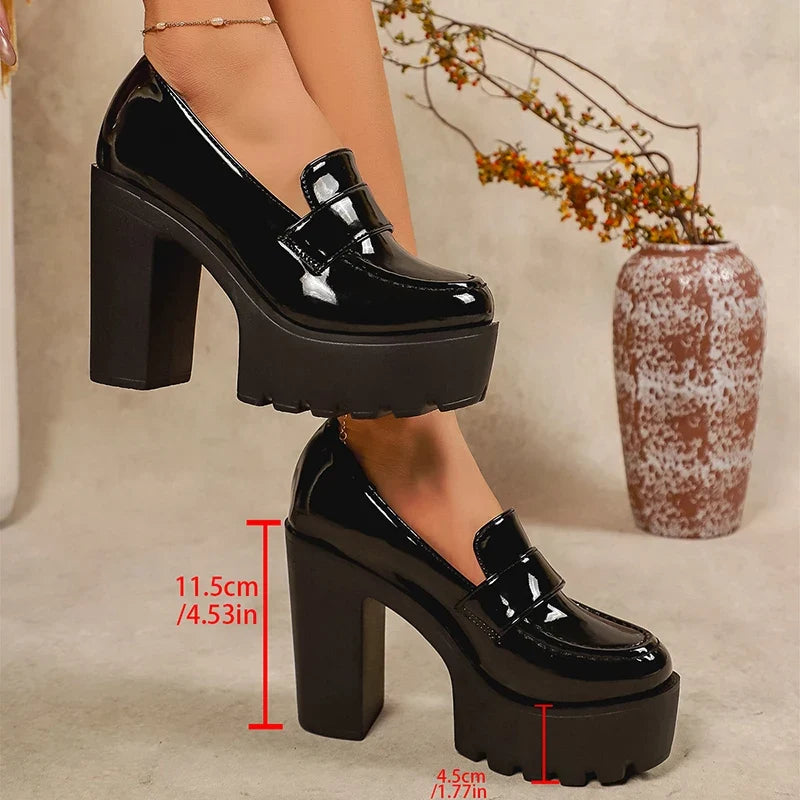 Black patent platform loafers with thick block heels and measured height