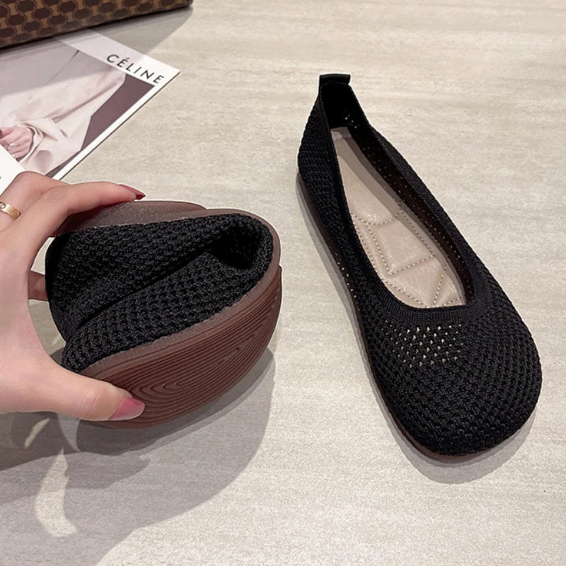 Women’s knit slip-on flats in black, breathable mesh upper with cushioned insole