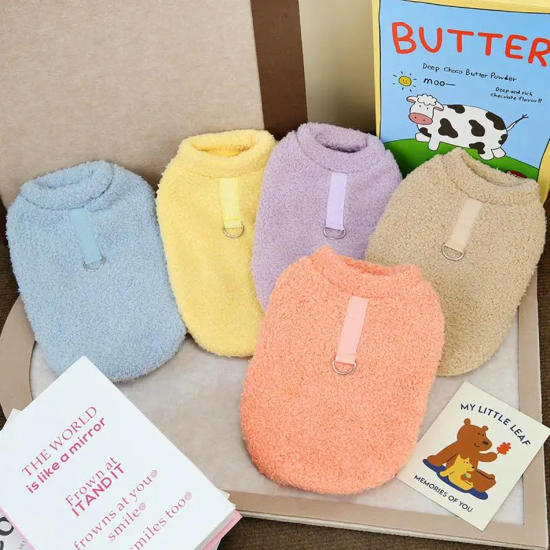 Plush dog hoodie with hood opening and paw cutouts, pastel blue, yellow, purple, orange
