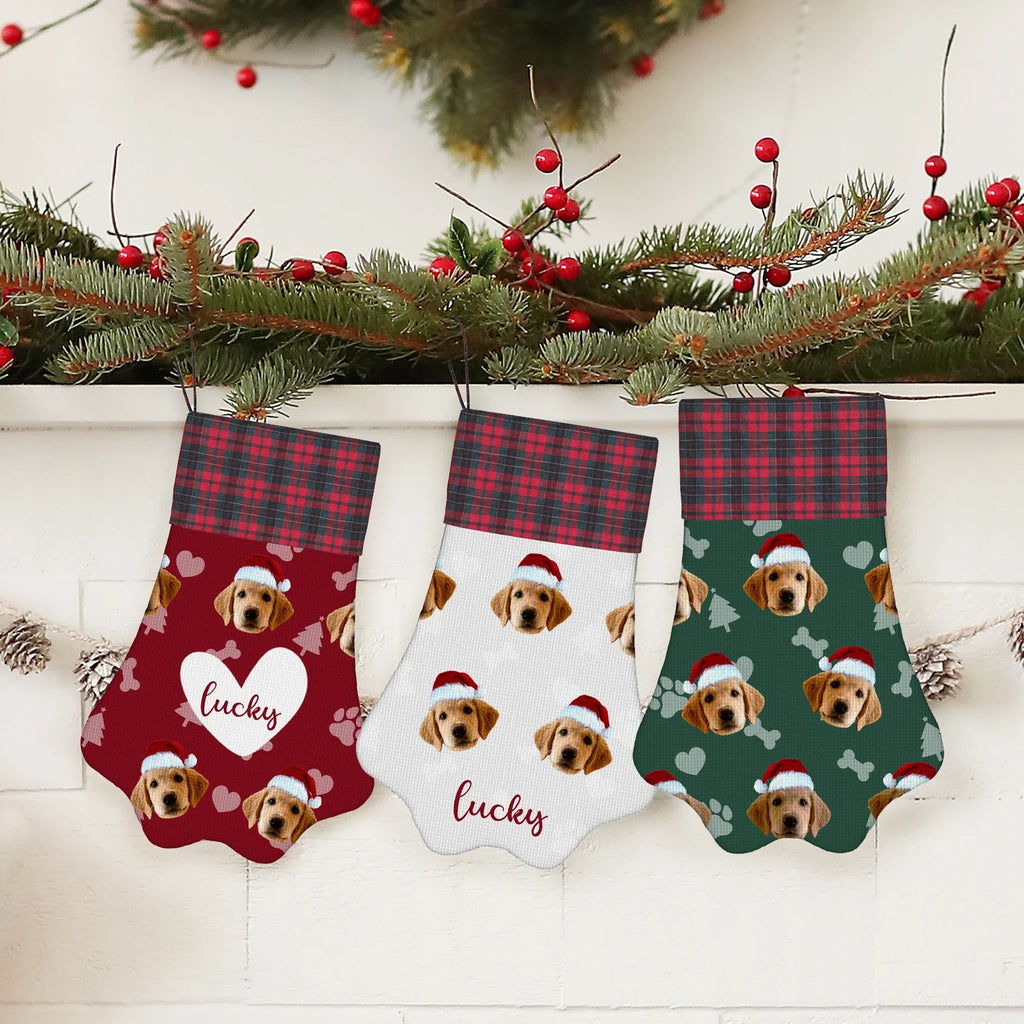 Three personalized dog Christmas stockings with red plaid cuffs; “Lucky” and “lotte”