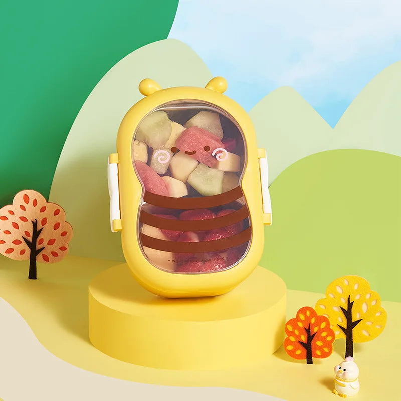 Yellow bee-shaped bento box with transparent lid showing colorful food