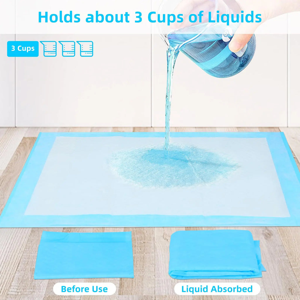 Blue pee pad with liquid being poured; two folded pads on the floor
