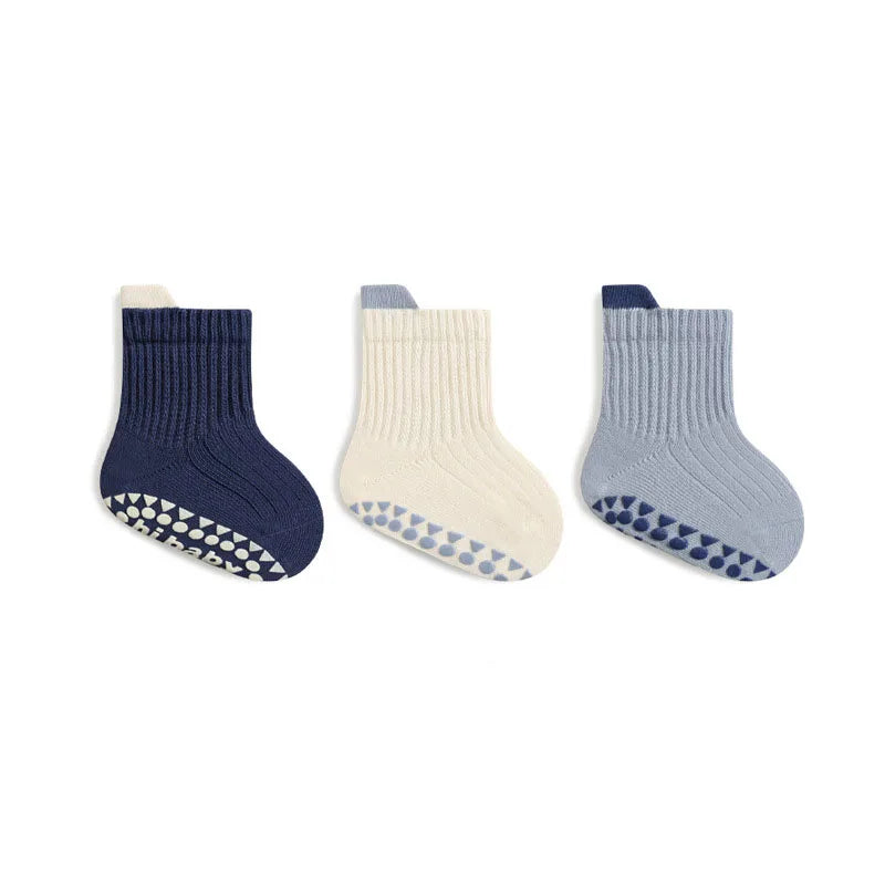Kids cotton crew socks set: navy, cream, and light blue with non-slip dot grippers