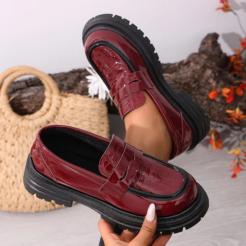 Red patent leather chunky platform loafers with round toe and front strap