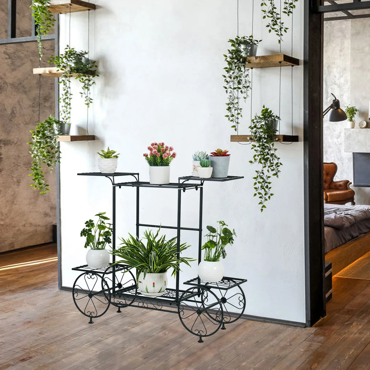 Black three-tier plant display rack with curved wheels and grid shelf surfaces