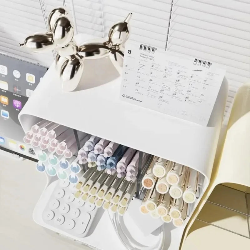 White desk pen organizer with top compartments holding pens and small containers