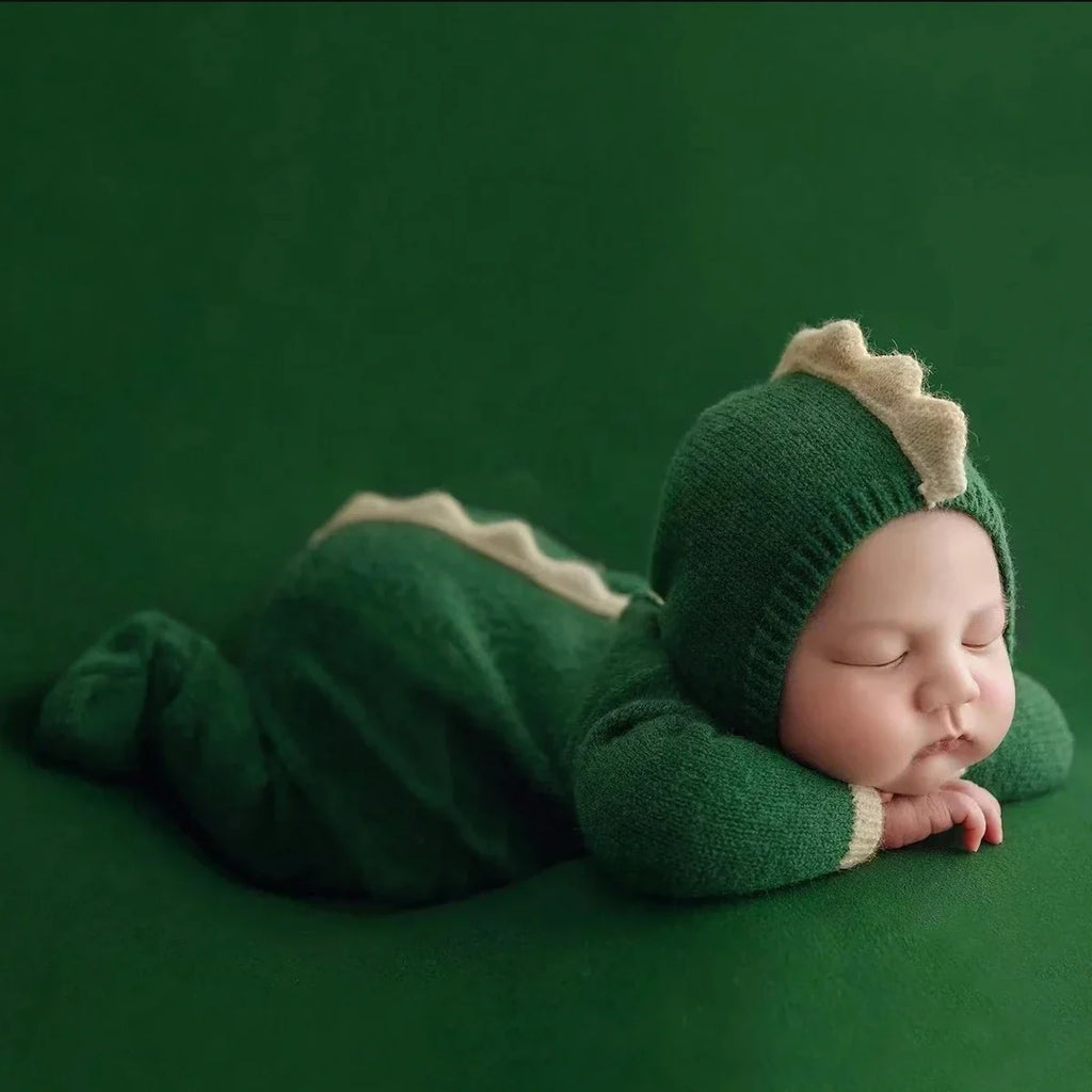 Green knitted newborn dinosaur hooded jumpsuit with beige-trim hat