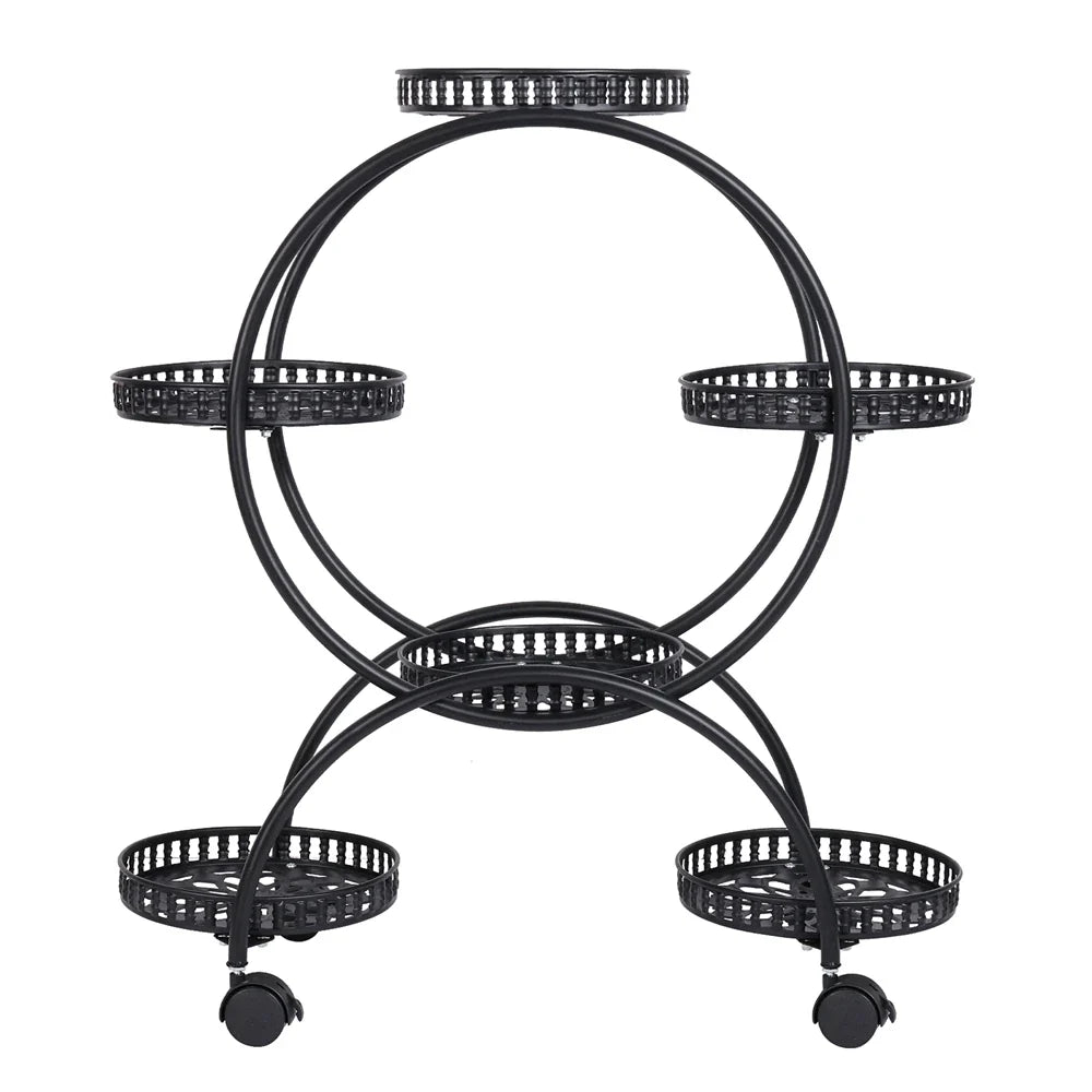 Black metal rolling plant stand with four perforated trays and caster wheels