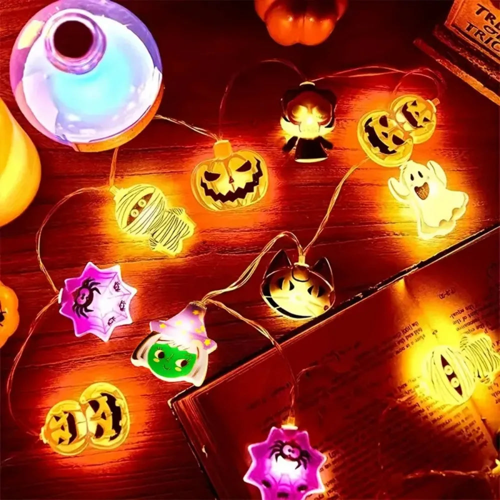 Halloween LED light string with glowing pumpkin, ghost, spiderweb, and witch hat character bulbs