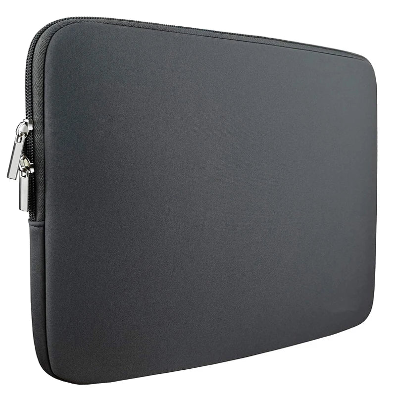 Grey padded laptop sleeve with zippered edge and smooth fabric shell.