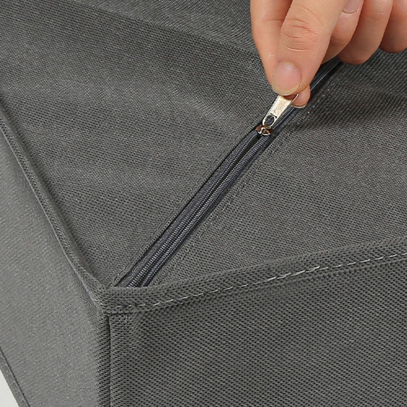Gray foldable organizer bin with stitched edge and zipper closure detail