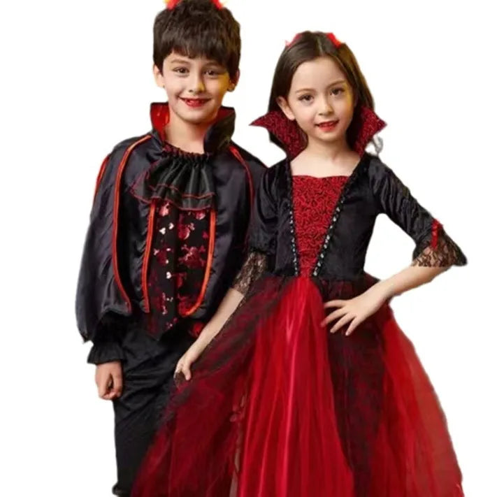 Kids vampire costume outfits close-up: boy in black/red and girl in black-and-red dress