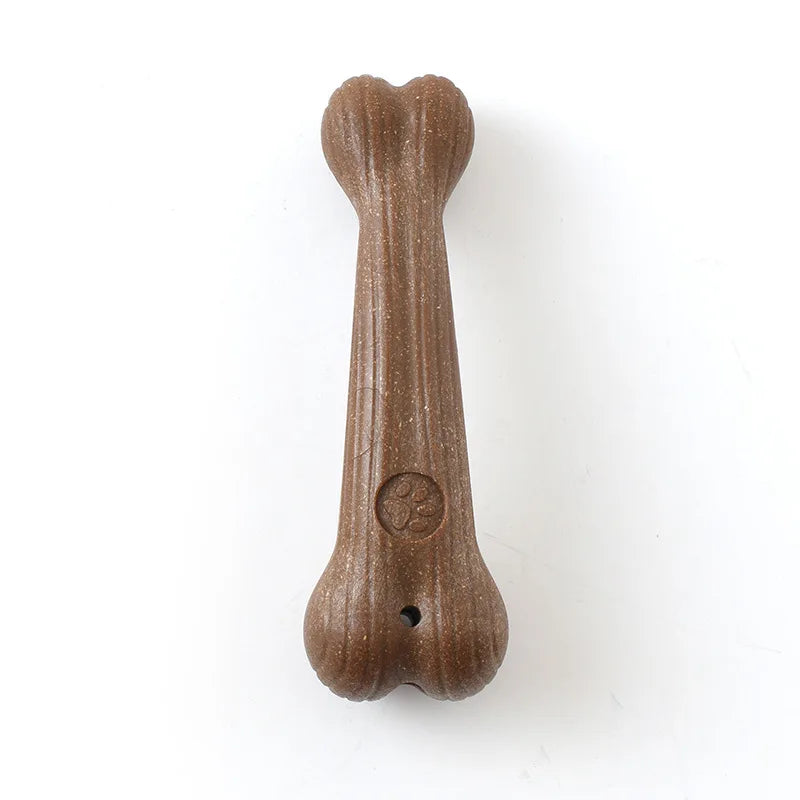 Brown rounded pet teeth grinding chew toy with face emblem and small hole