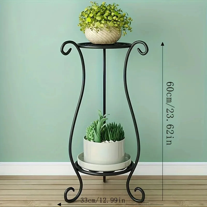Black metal plant stand with two tiers, scroll feet, and single center support pole