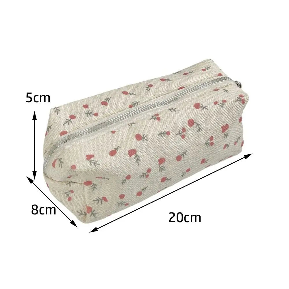 Beige canvas pencil pouch with zipper and red cherry floral pattern; 20cm long