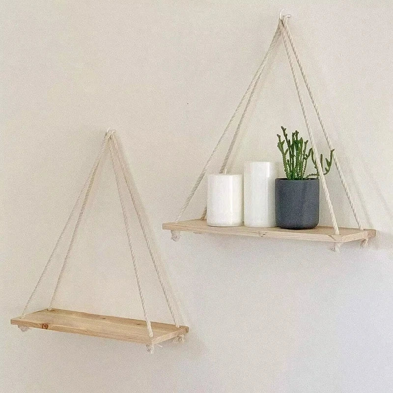 Hanging hemp-rope wooden shelf pair with candles and potted greenery, triangular design
