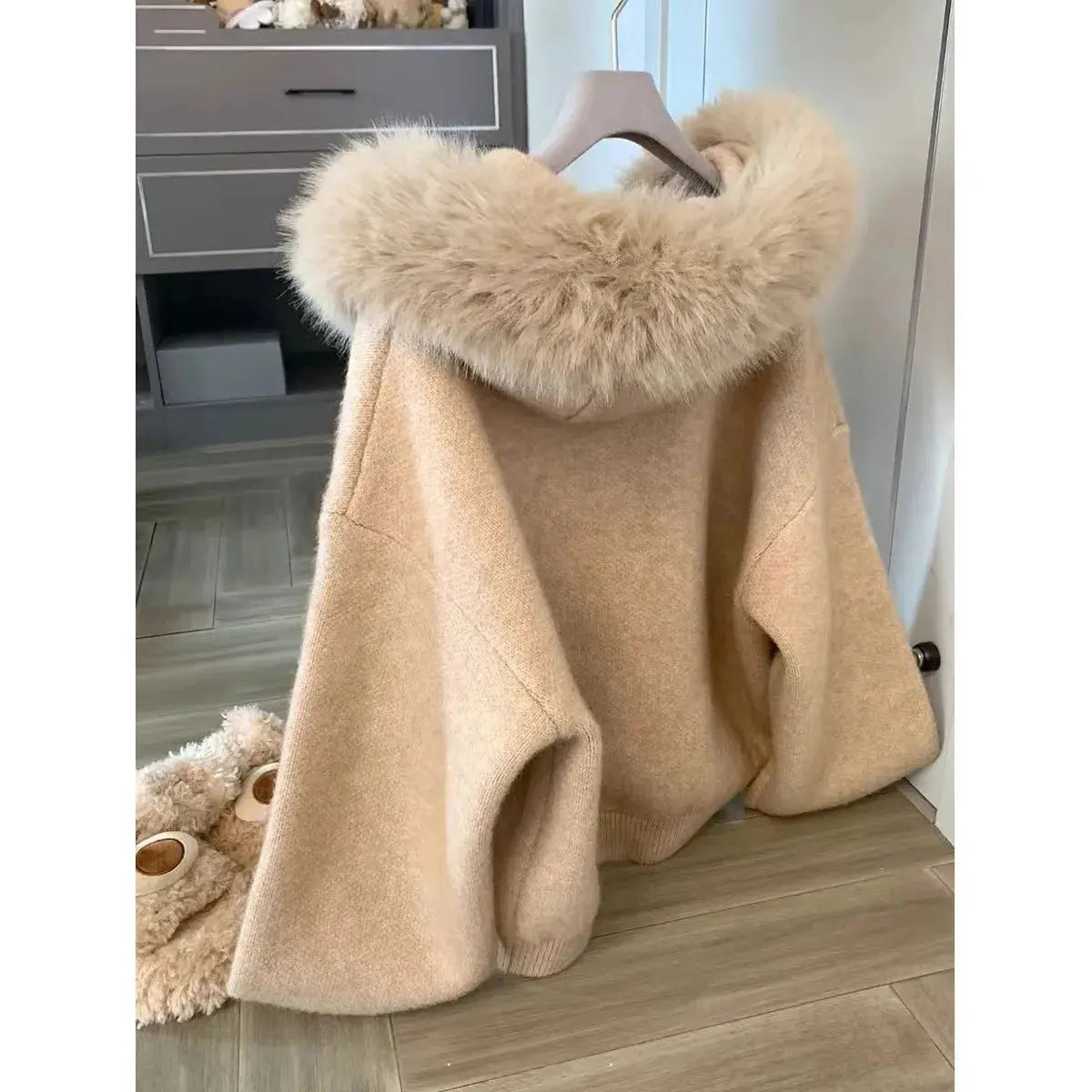 Khaki sweater jacket with faux-fur hood lining and open front hem detail