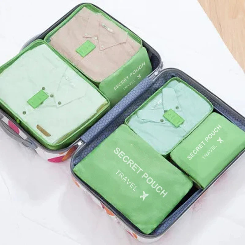 Green waterproof packing cube set with 6 pouches in a navy-framed zip case