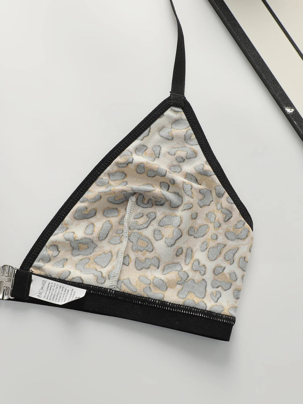 Leopard print triangle bralette lining with black straps and silver front clasp