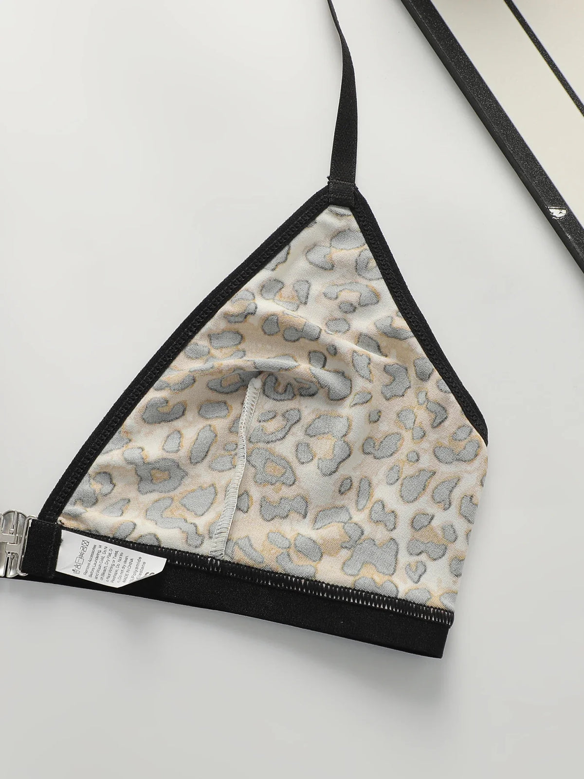 Leopard print triangle bralette lining with black straps and silver front clasp