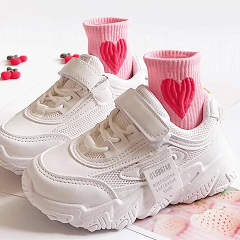 Girls pink mid-calf socks with red heart, shown with sneakers and laces