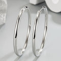 Pair of thick silver hoop earrings, polished smooth round hoops