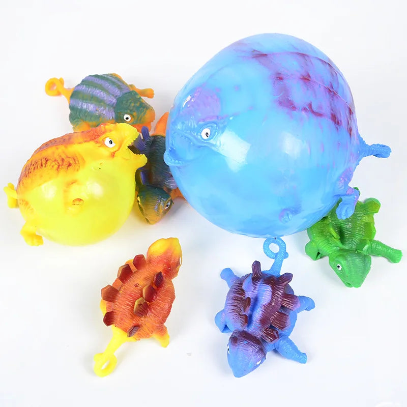 Inflatable dinosaur squeeze vent balls, assorted colors including blue, green, and yellow.