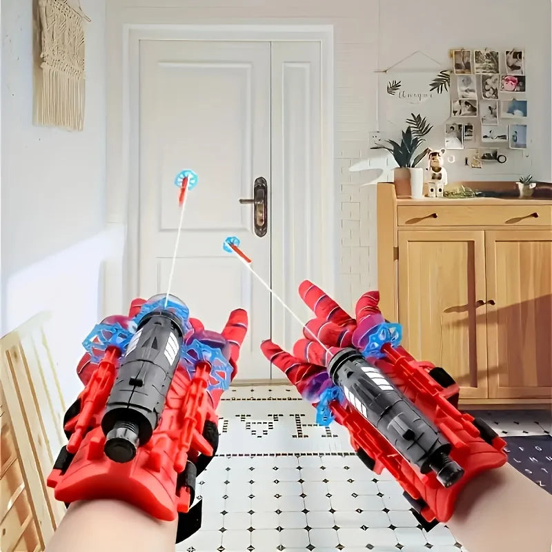 Superhero wrist launcher toys on hands, red mesh gloves with blue web cartridges