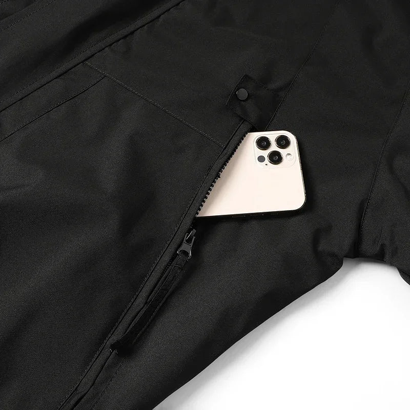 Unisex waterproof windbreaker jacket with zip pocket holding a phone, dark color.