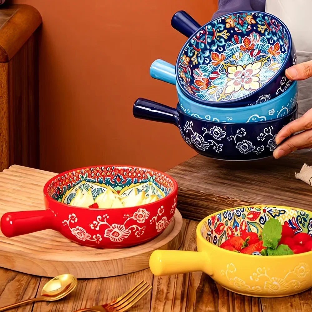 Ceramic salad bowl with red handle, blue floral embossed pattern, decorative rim