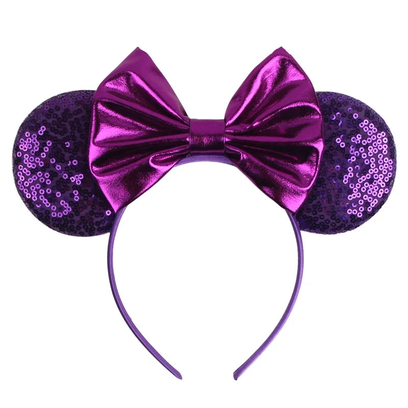 Purple sequin Mickey-style ears headband with shiny purple bow and curved band.