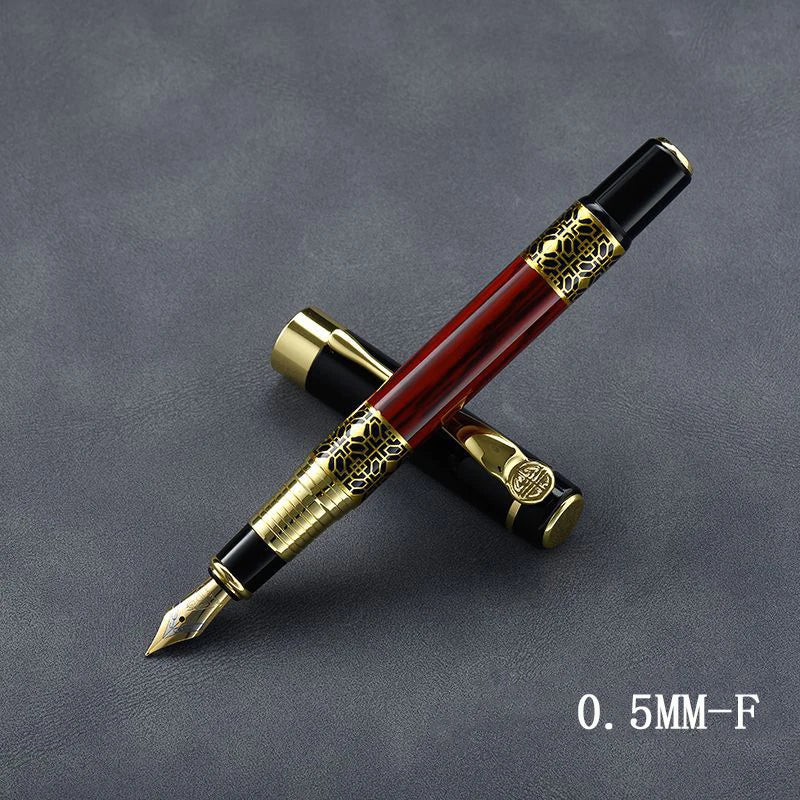 Red metal fountain pen with gold accents and fine nib, 0.5 mm