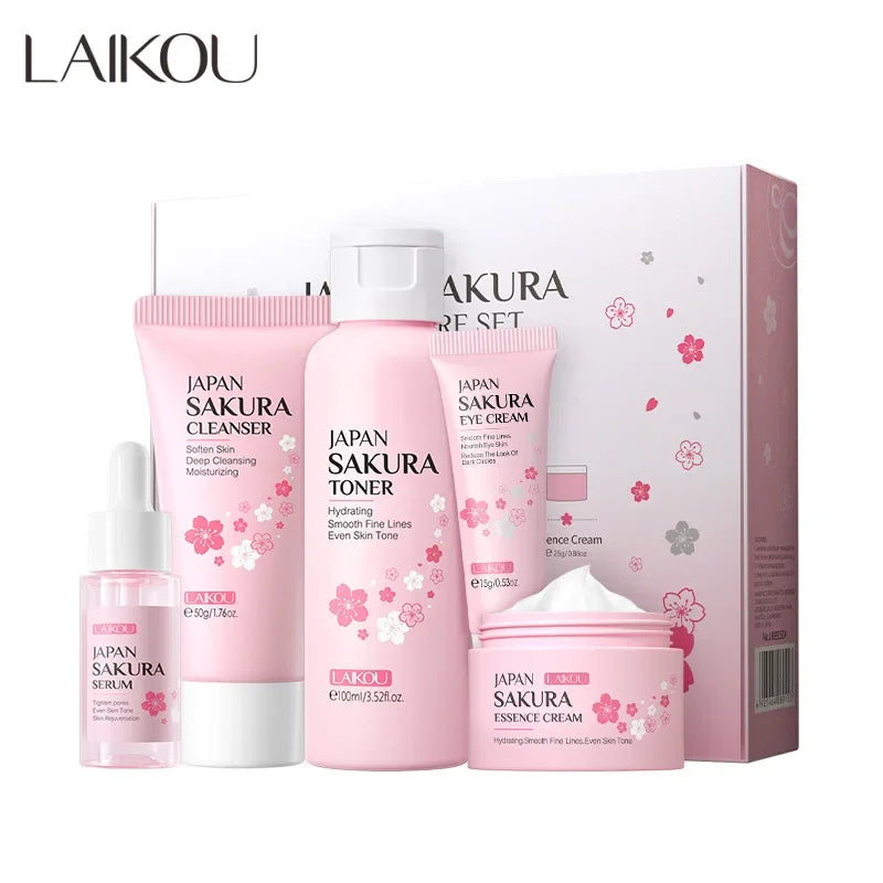 Sakura skincare set box with five pink face cleanser, toner, serum, cream, and eye cream bottles