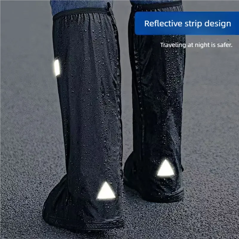 Pair of black waterproof high-top shoe covers with reflective strip accents